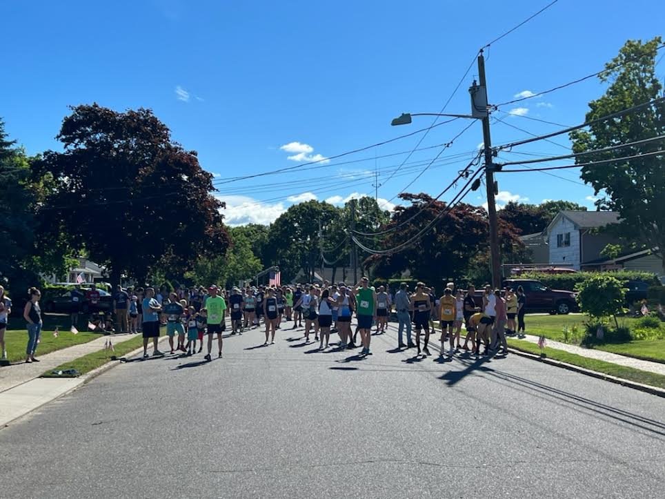 With hundreds of runners, the Sayville Fire Department 5K filled Broadway Avenue.